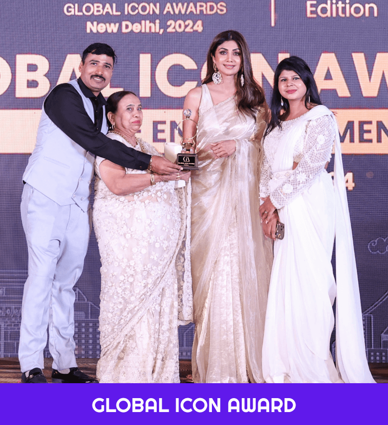 Deepak Dhingra and family receiving the Global Icon Award from Shilpa Shetty